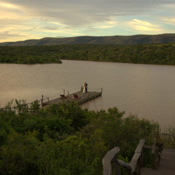 Pumba Private Game Reserve Weddings Water Lodge Couple On The Jetty From Afar